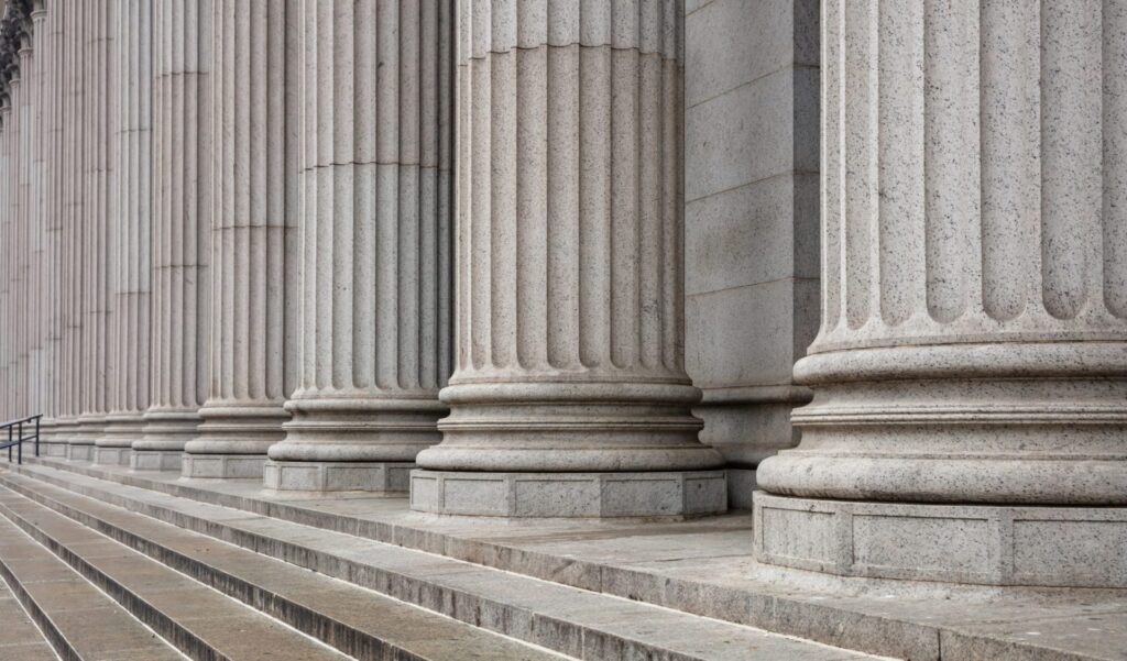 Steps and pillars outside the Supreme Court, representing how one can benefit from calling a Portland criminal defense lawyer.