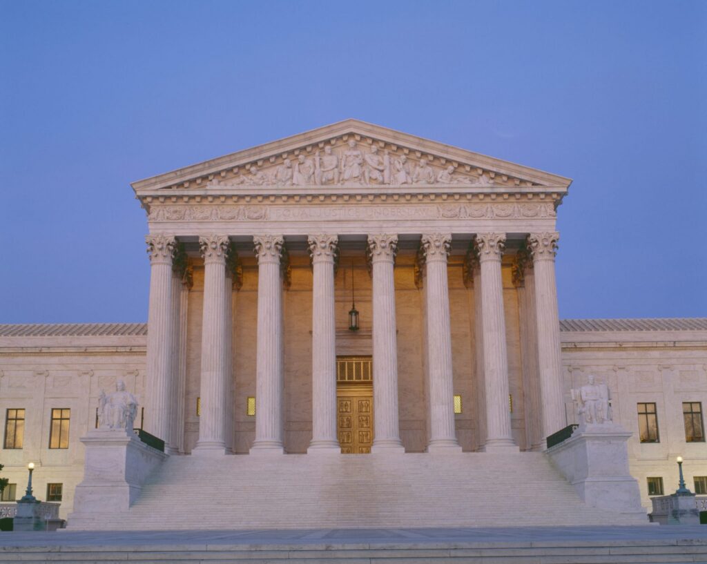 The outside of the Supreme court at dusk, representing how one can benefit from calling a Portland criminal defense attorney.