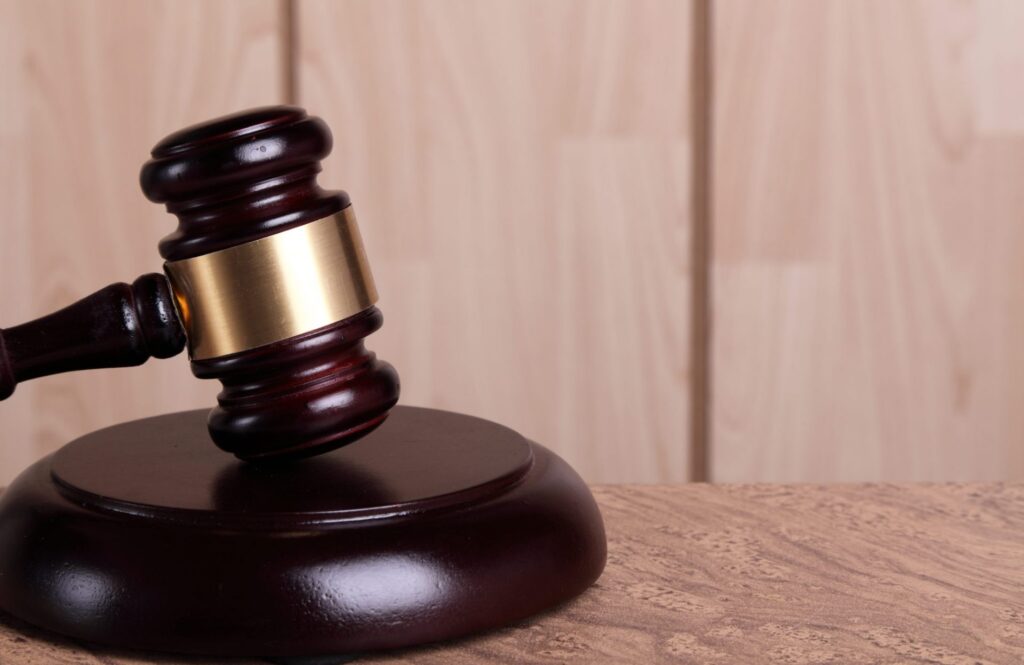 A judge's gavel resting on a block, representing how one can benefit from calling a Portland criminal defense attorney.