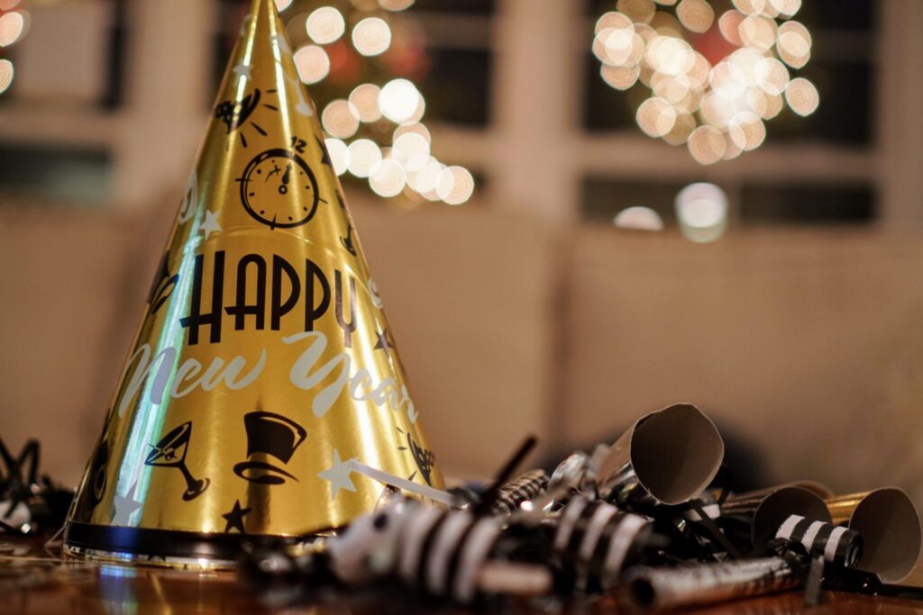 A party hat and decoration for a New Year's Eve celebration, representing how one can benefit from calling a Portland criminal defense lawyer.