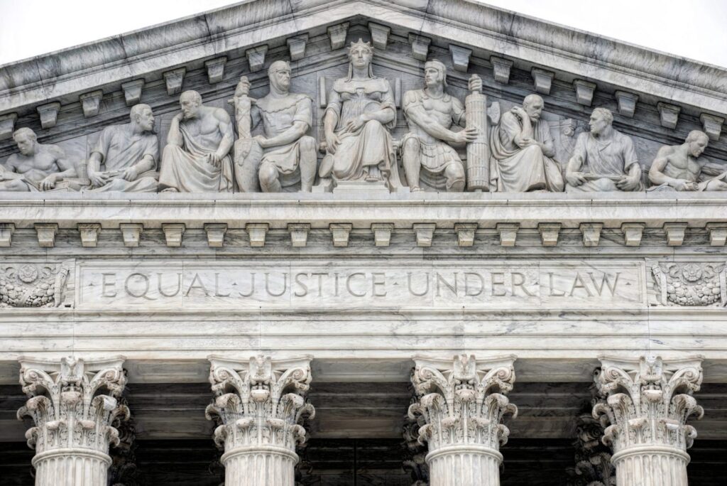 The outside of the Supreme Court with white pillars, representing how one can benefit from calling a Portland criminal defense lawyer.