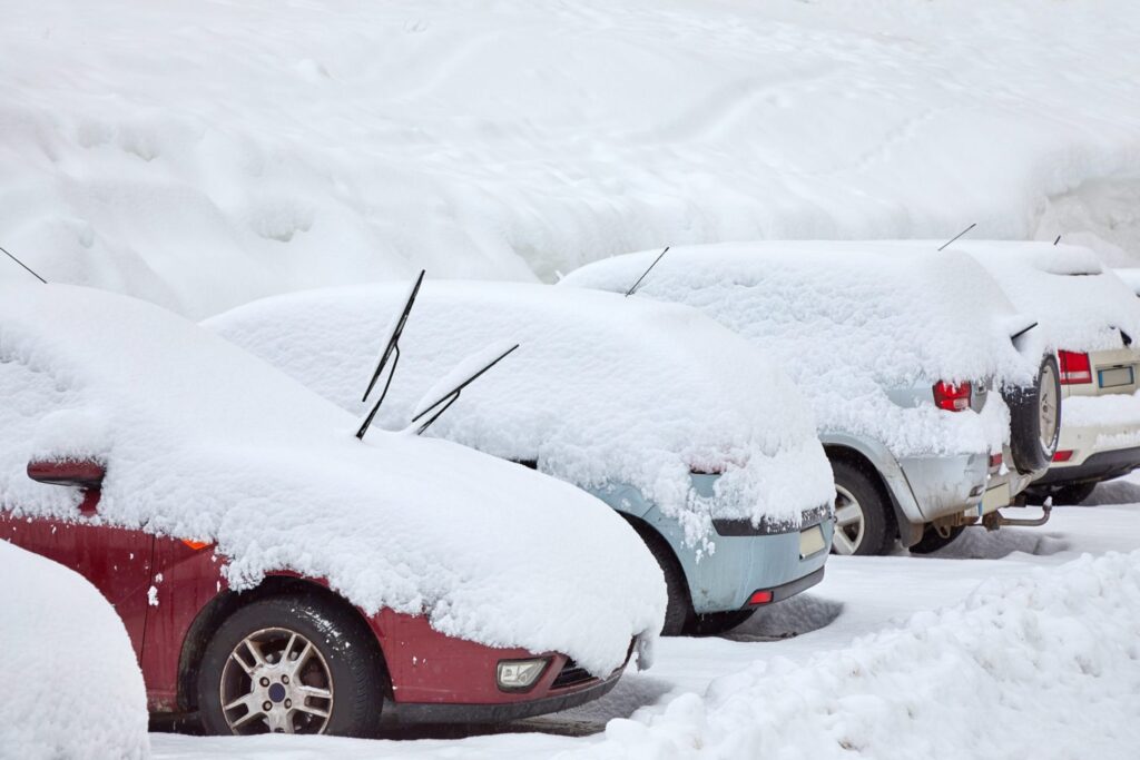 Several cars covered in snow, representing how one can benefit from calling a Portland criminal defense lawyer.