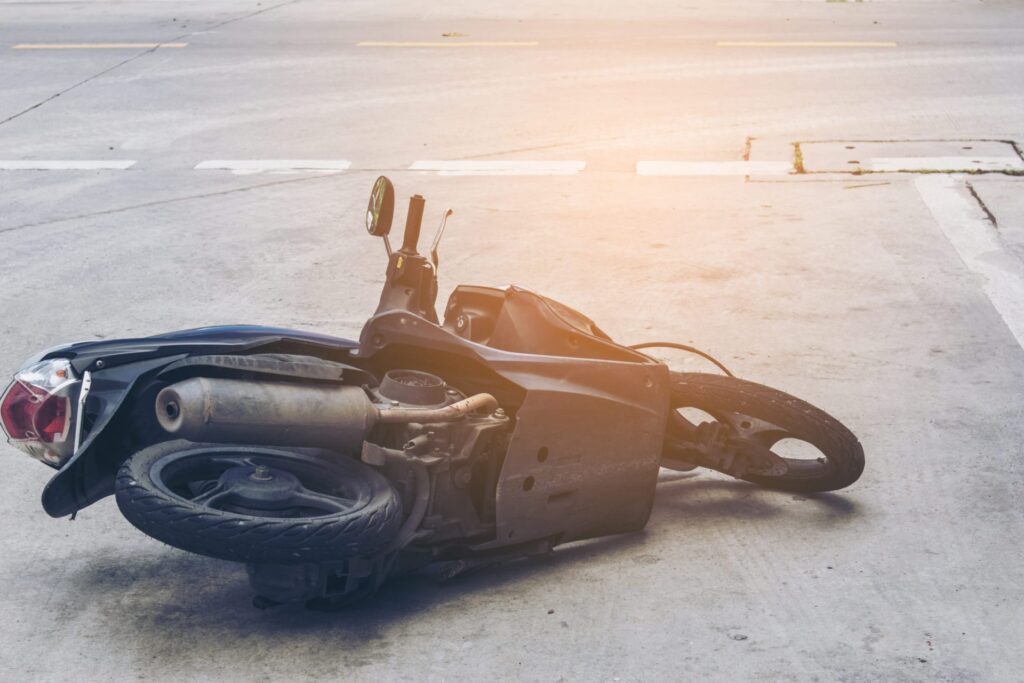 A motorcycle lying on the floor, representing how one can benefit from calling a Portland criminal defense lawyer.