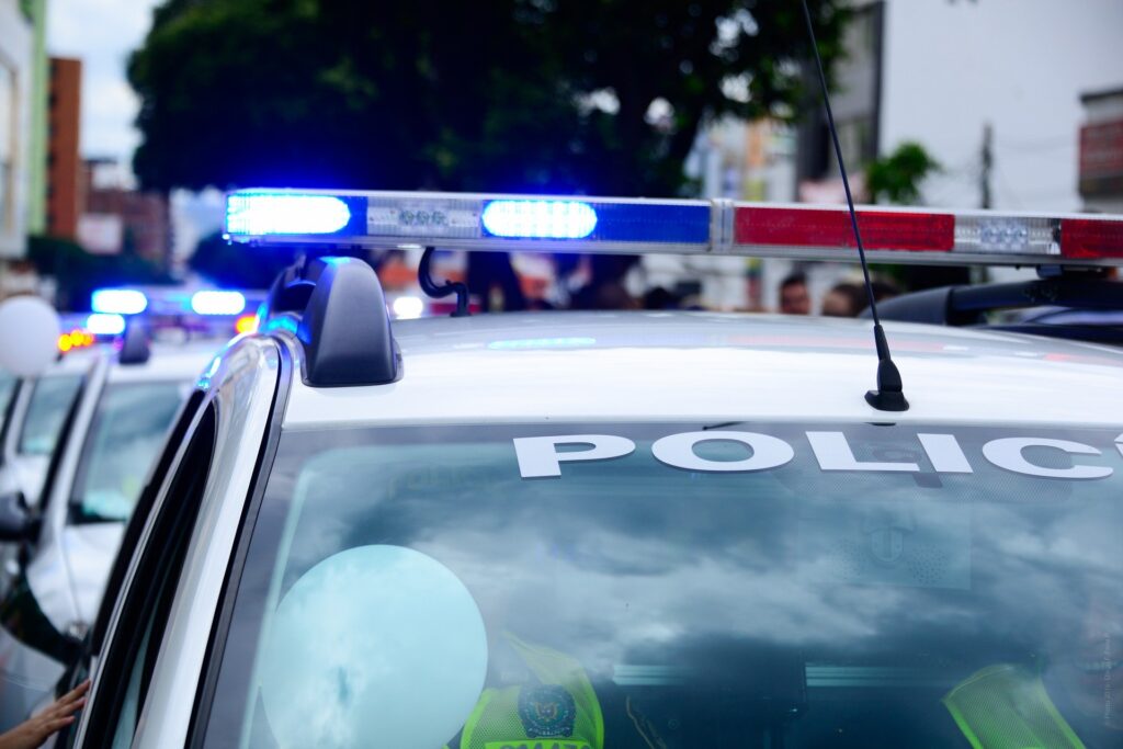 What is Custodial Interrogation in Maine represented by a police car in downtown Portland, Maine