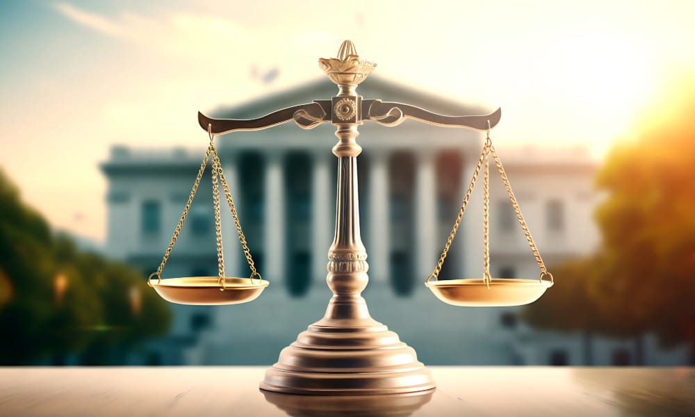 What to Expect After a Mane Child Pornography Charge portrayed by scales of justice in front of a courthouse on a sunny day in Maine.